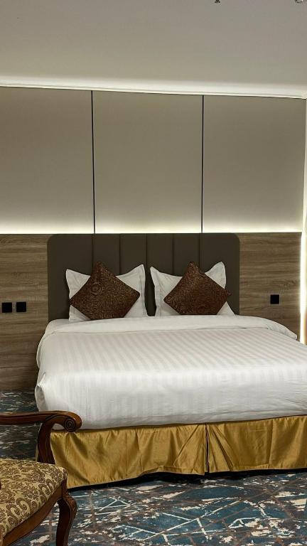 Postel nebo postele na pokoji v ubytování Sadeem Al Fajr Hotel Suites