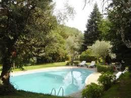 a large swimming pool in a yard with trees at Rancho La Herradura in Arenas de San Pedro