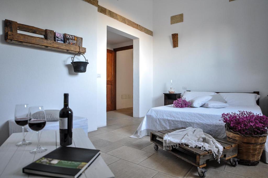 Postel nebo postele na pokoji v ubytování Masseria Uccio
