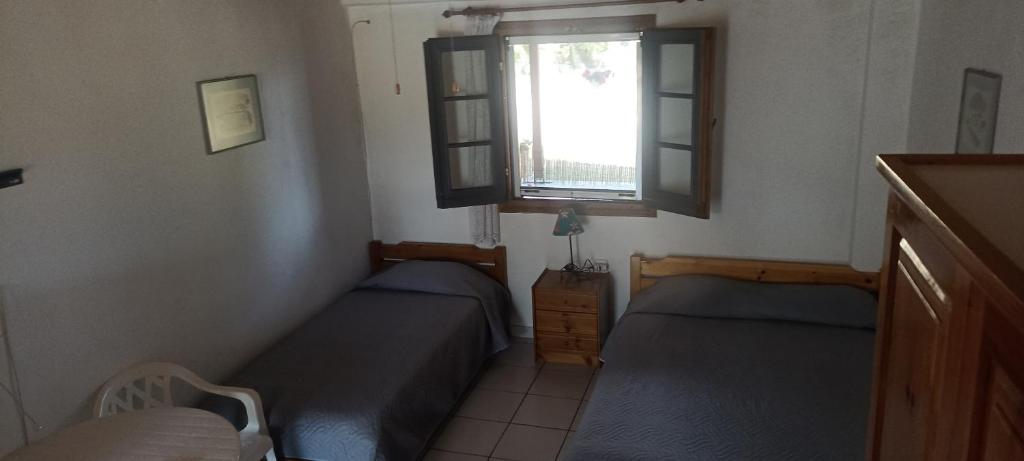 Posezení v ubytování Poseidon room's Vourvourou