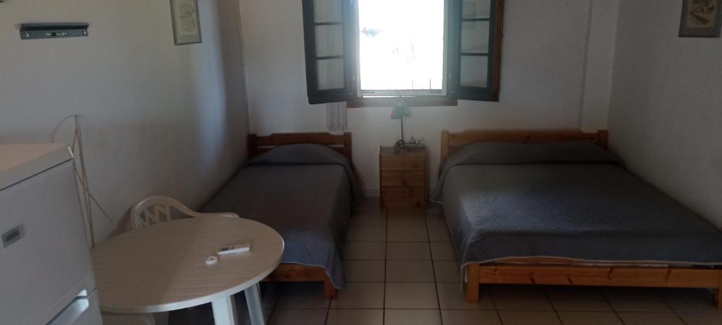 Posezení v ubytování Poseidon room's Vourvourou
