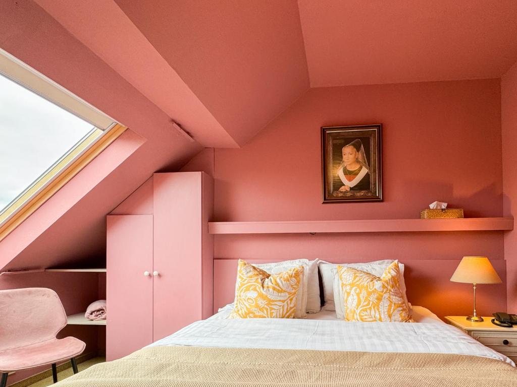 Postel nebo postele na pokoji v ubytování Hotel Botaniek