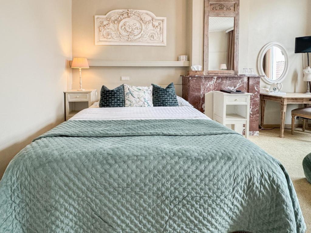 Postel nebo postele na pokoji v ubytování Hotel Botaniek