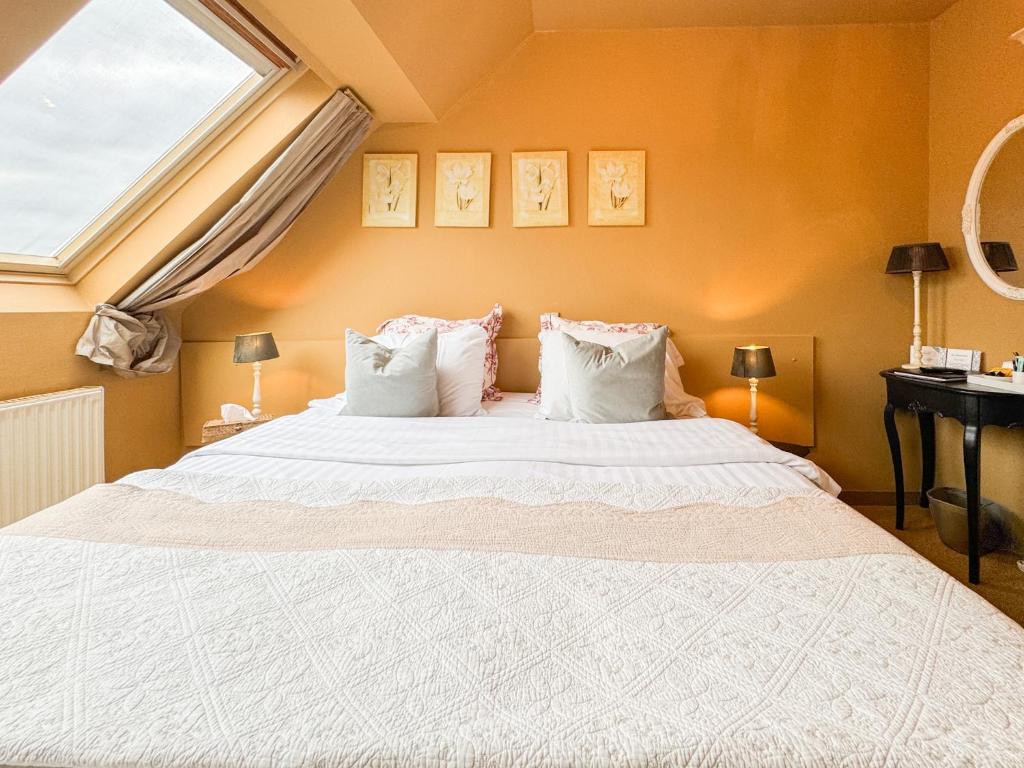 Postel nebo postele na pokoji v ubytování Hotel Botaniek