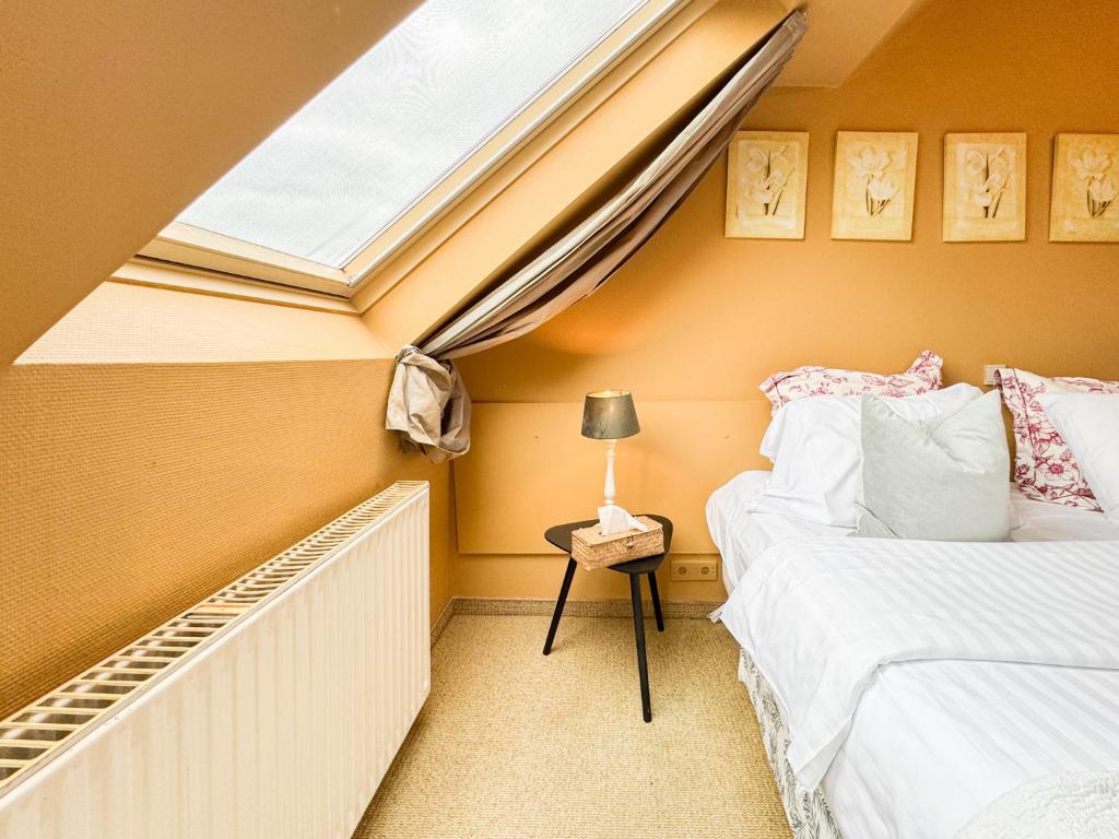 Postel nebo postele na pokoji v ubytování Hotel Botaniek
