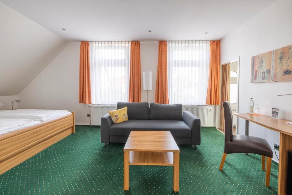 Postel nebo postele na pokoji v ubytování Hotel Schaper