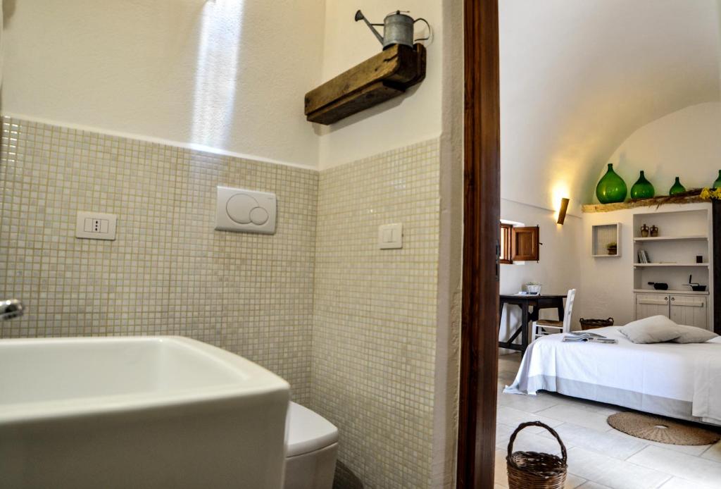 Postel nebo postele na pokoji v ubytování Masseria Uccio