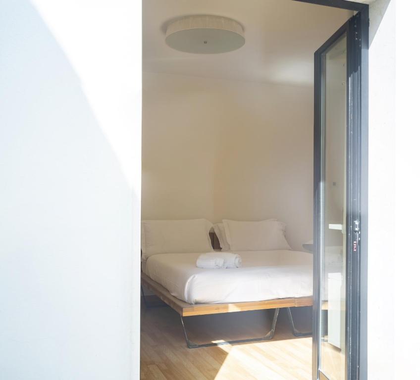 Llit o llits en una habitació de Imago Plus Hotel