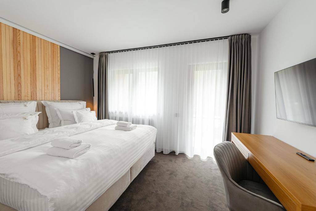 Postel nebo postele na pokoji v ubytování Terra Resort