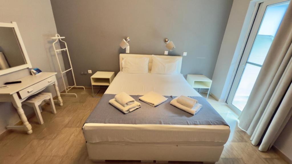 Postel nebo postele na pokoji v ubytování Ponti Beach Hotel