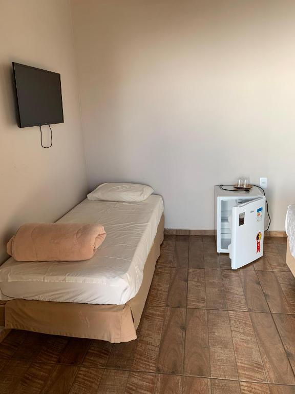 Postel nebo postele na pokoji v ubytování Pousada Fazenda Guartelá