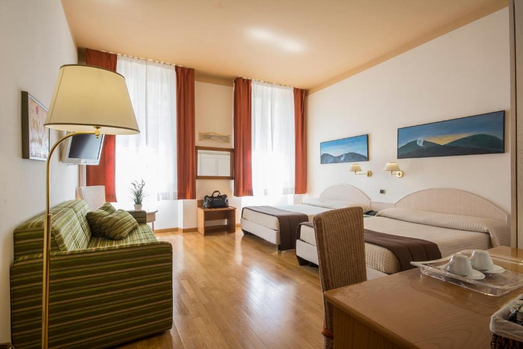 Postel nebo postele na pokoji v ubytování Piazza Paradiso Accommodation
