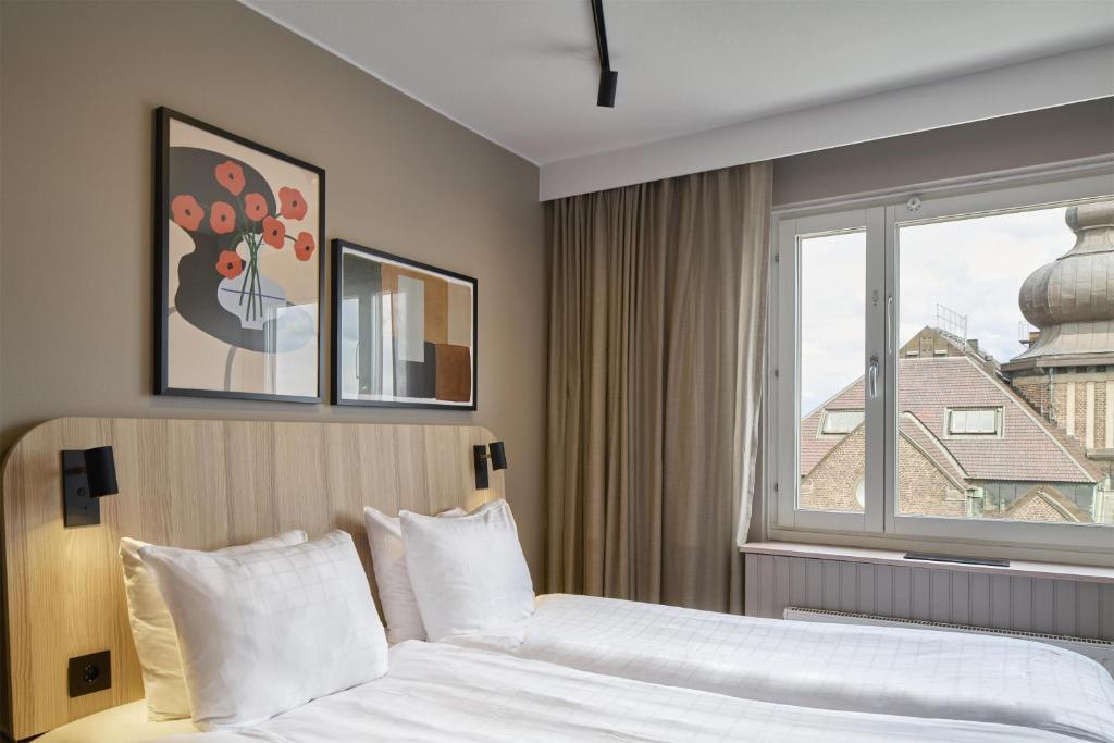 Postel nebo postele na pokoji v ubytování Scandic Sjöfartshotellet