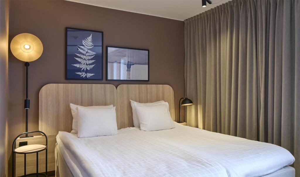 Postel nebo postele na pokoji v ubytování Scandic Sjöfartshotellet