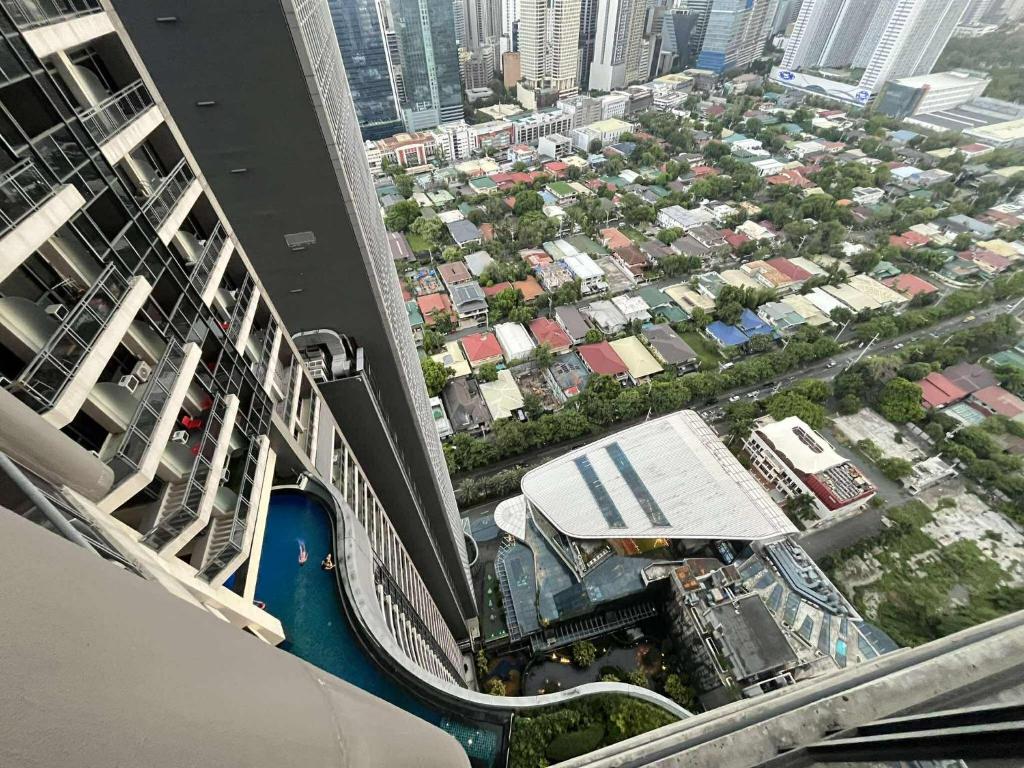 an aerial view of a city from a building at Gramercy Makati Condotel in Manila
