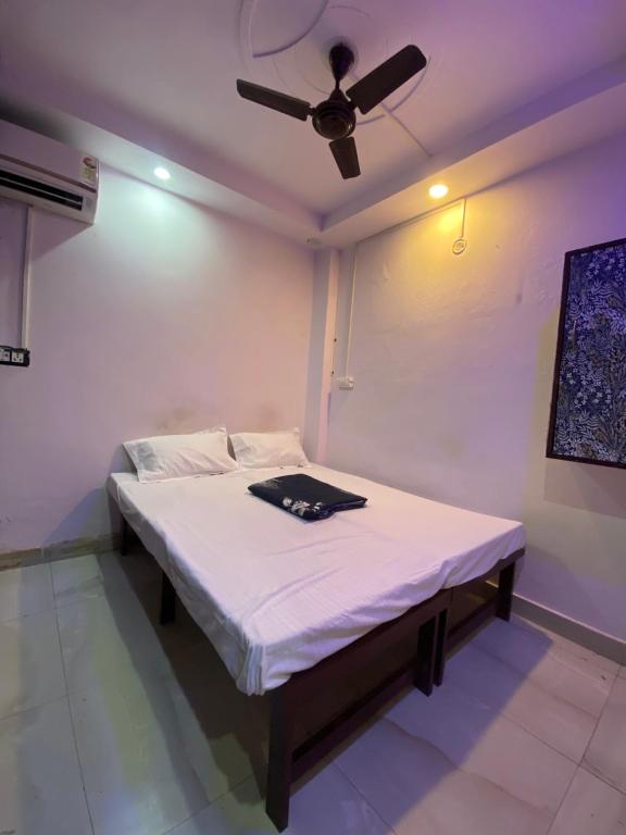 Ένα ή περισσότερα κρεβάτια σε δωμάτιο στο Cozy Inn Hostel