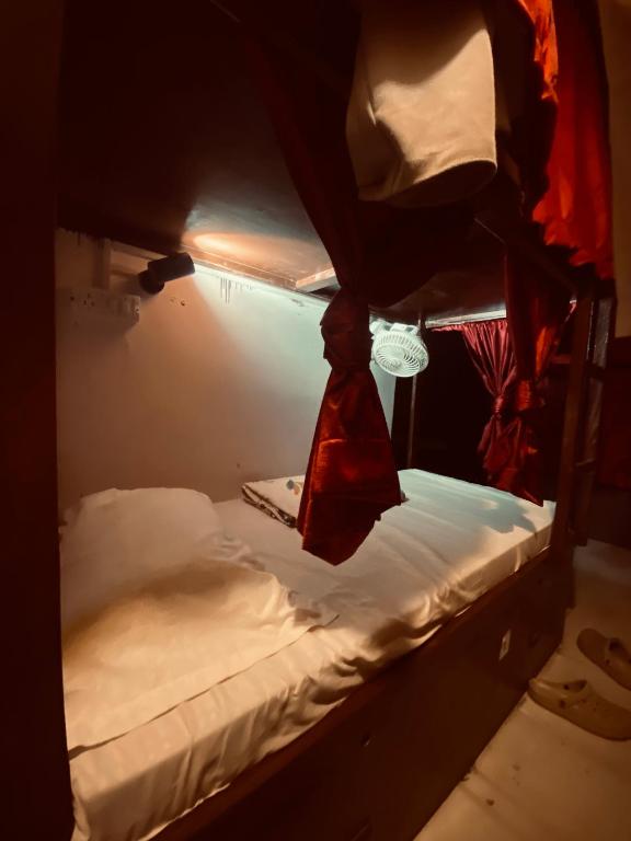 Ένα ή περισσότερα κρεβάτια σε δωμάτιο στο Cozy Inn Hostel