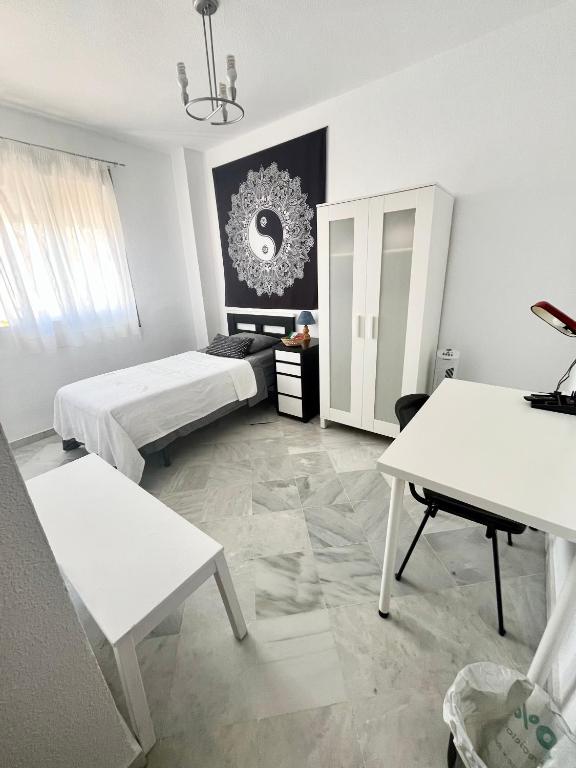 Postel nebo postele na pokoji v ubytování Sevillabienestar