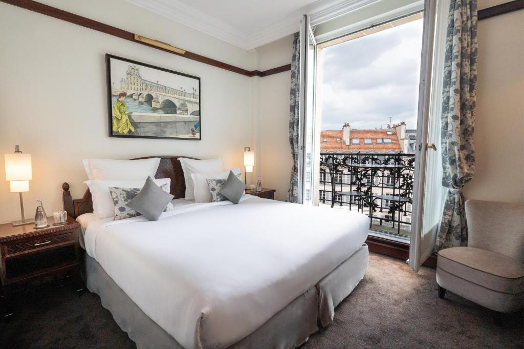 Ένα ή περισσότερα κρεβάτια σε δωμάτιο στο Hôtel Pont Royal Paris