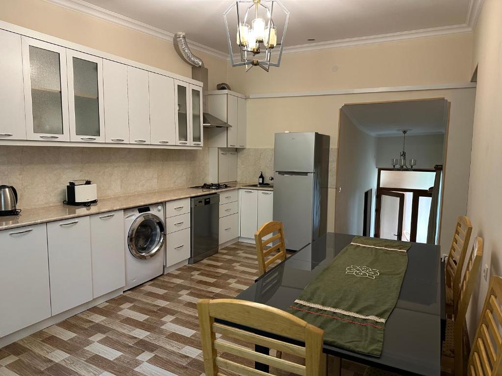 Kuchyň nebo kuchyňský kout v ubytování TAGANI Guest House