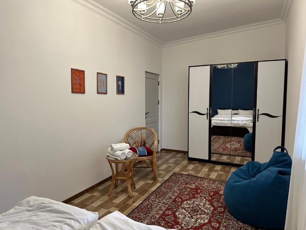 Postel nebo postele na pokoji v ubytování TAGANI Guest House