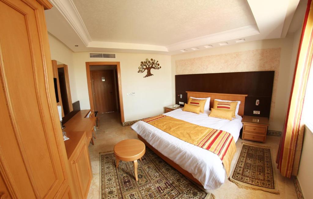 Postel nebo postele na pokoji v ubytování Hotel Julius