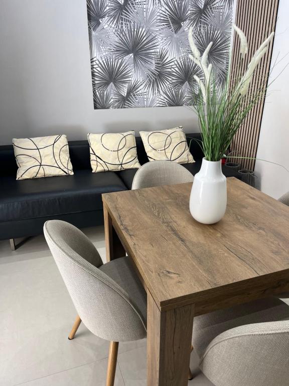 a living room with a table and a couch at Sofia e Clara Mozia in Marsala