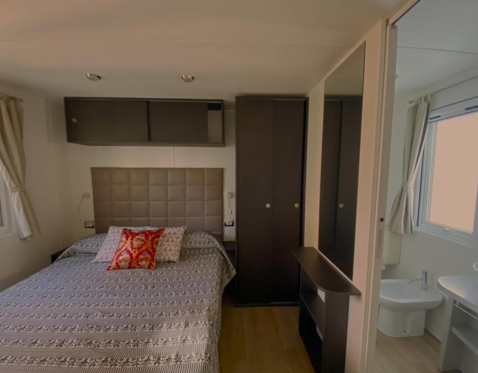 Letto o letti in una camera di Camping Torre di Barisardo