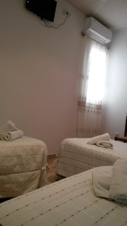 Posteľ alebo postele v izbe v ubytovaní Hostal Virgen Del Pilar