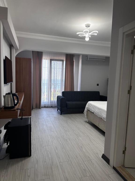 A bed or beds in a room at KILIÇ MOTEL