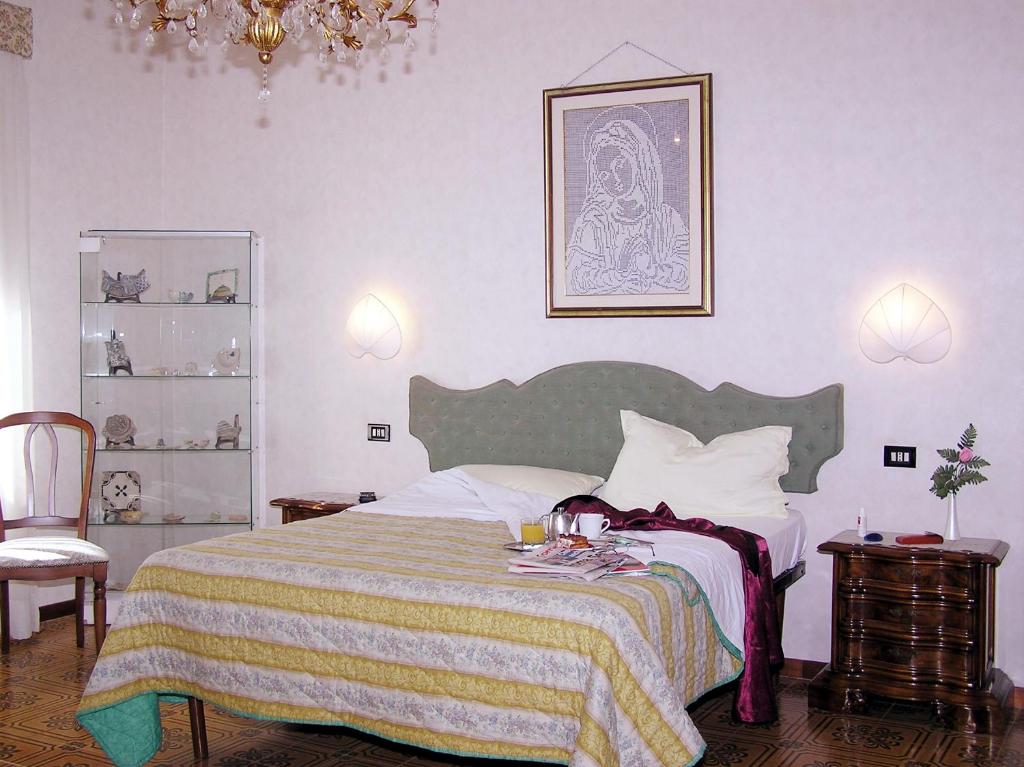 Postel nebo postele na pokoji v ubytování Hotel Ristorante Bagnaia