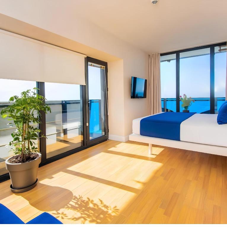 Postel nebo postele na pokoji v ubytování Panorama Orbi City Aparthotel
