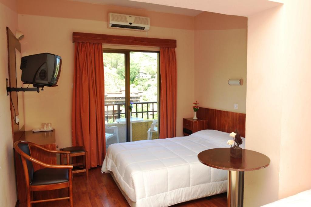 Postel nebo postele na pokoji v ubytování Ekali Hotel