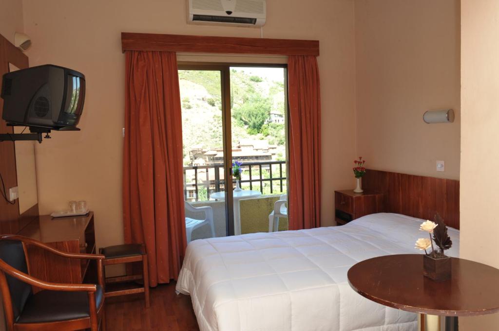 Postel nebo postele na pokoji v ubytování Ekali Hotel