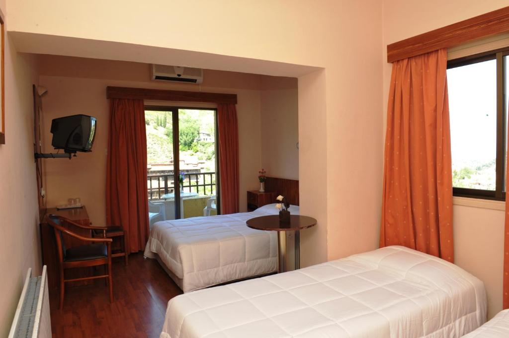 Postel nebo postele na pokoji v ubytování Ekali Hotel