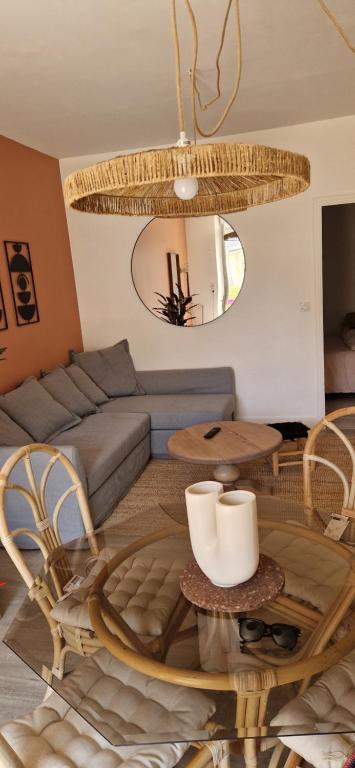a living room with a couch and a table at Appartement proche de la mer in Étel