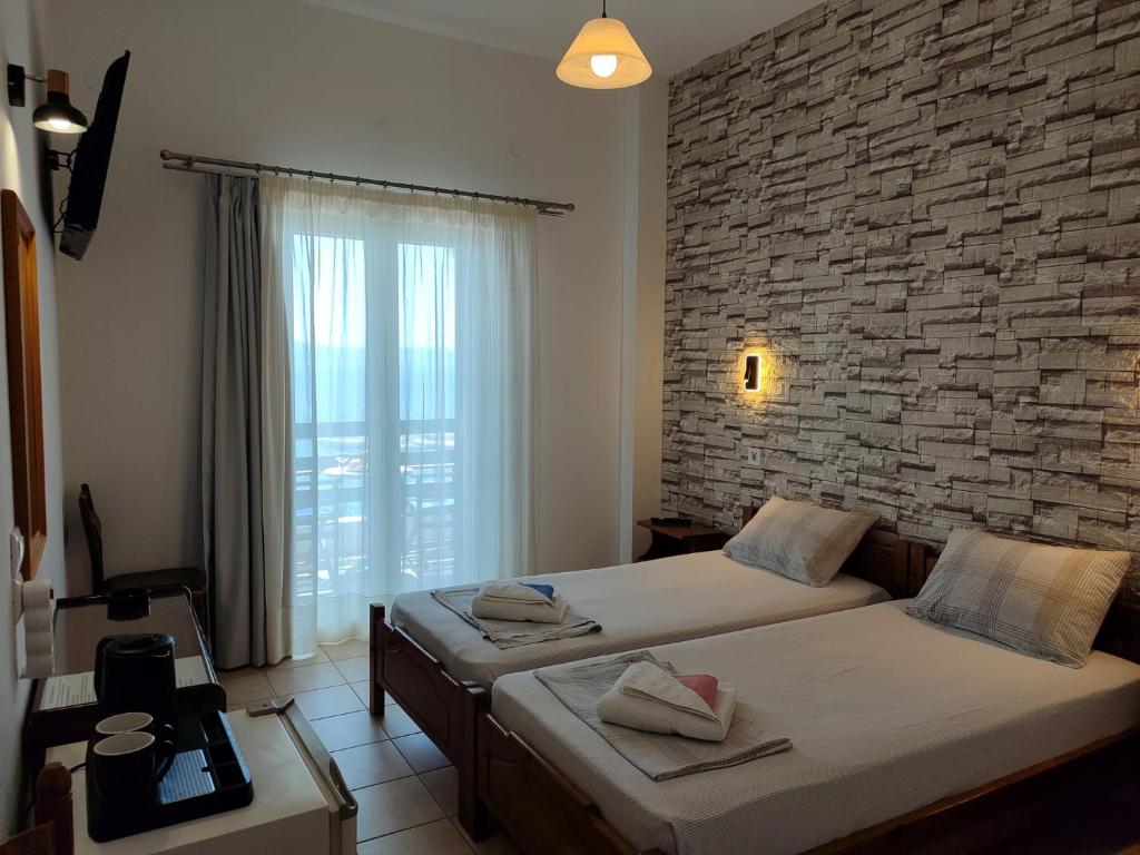 Postel nebo postele na pokoji v ubytování Corali Hotel