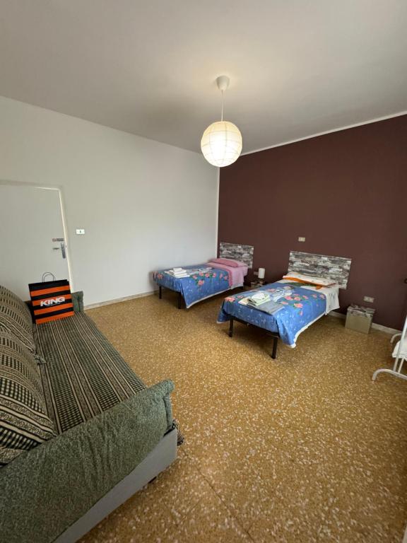 a room with two beds in a room at Affittacamere Lu Vurghe in Santa Maria