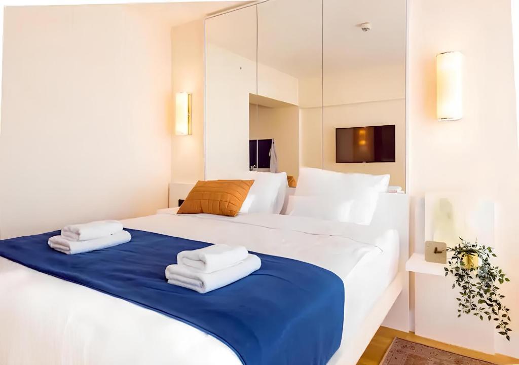 Postel nebo postele na pokoji v ubytování Panorama Orbi City Aparthotel