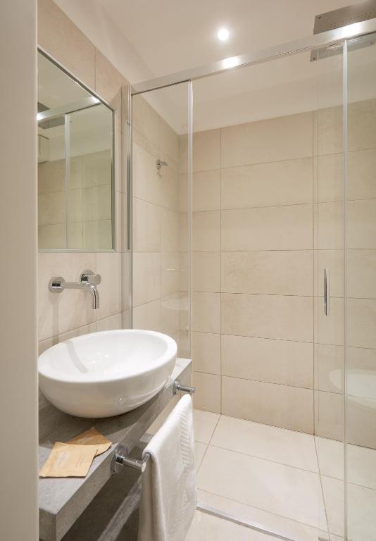 a bathroom with a sink and a shower at Stellamare in Caorle