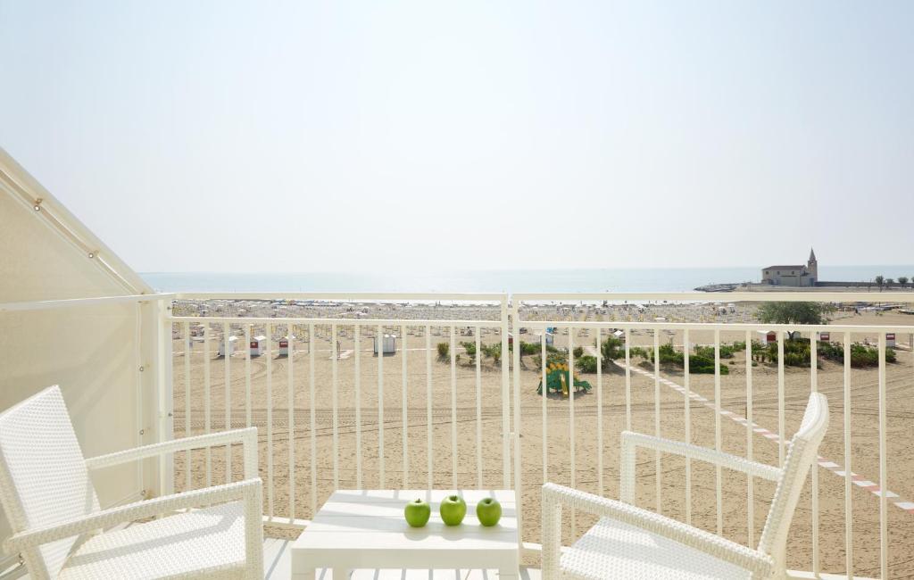 a balcony with a view of the beach at Stellamare in Caorle