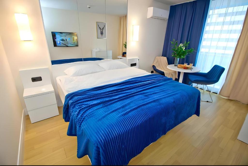 Postel nebo postele na pokoji v ubytování Panorama Orbi City Aparthotel