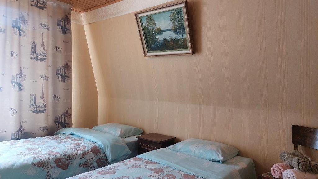 Postel nebo postele na pokoji v ubytování KODU