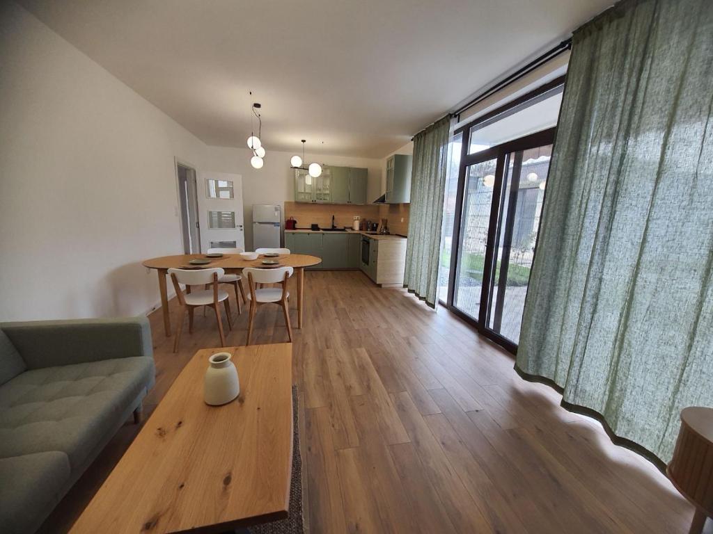 a living room with a couch and a table at Вила Фамилия - Villa Family in Lozenets