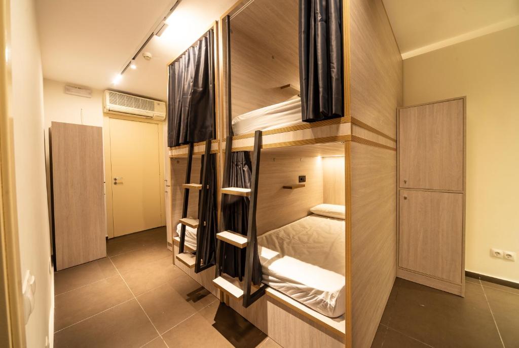 Postel nebo postele na pokoji v ubytování GG Hostel