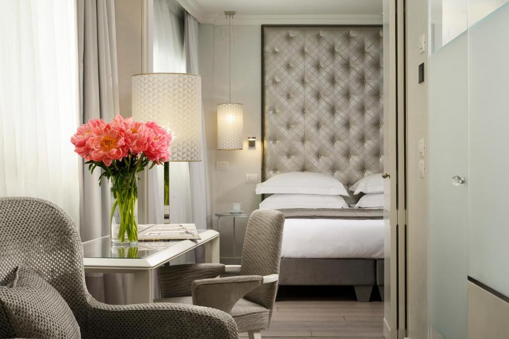 Postel nebo postele na pokoji v ubytování Ponte Vecchio Suites & Spa
