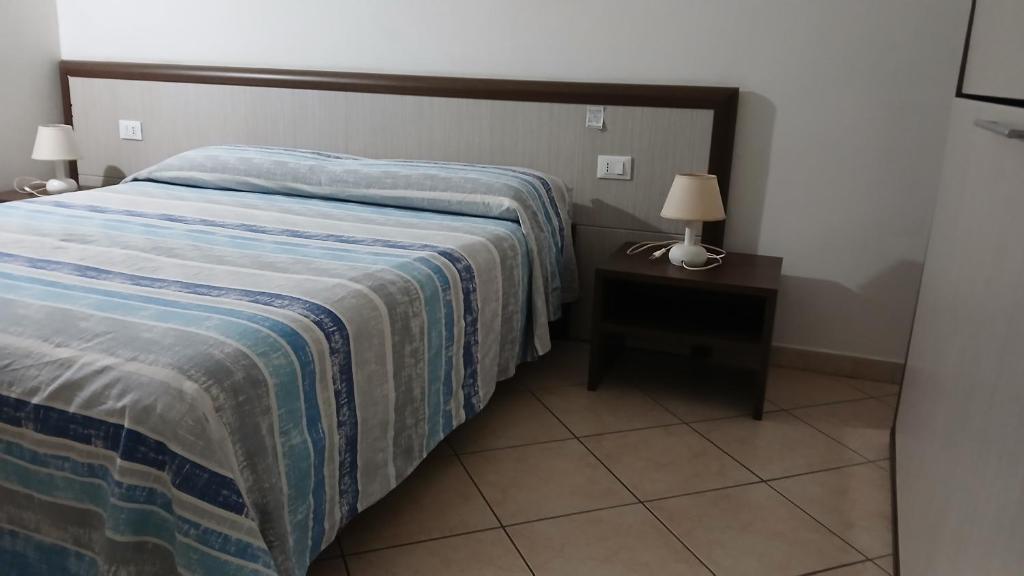 Postel nebo postele na pokoji v ubytování Domo - Guest-House Il Nespolo Fiorito