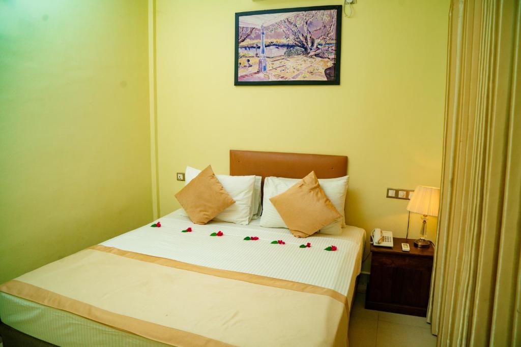 Postel nebo postele na pokoji v ubytování Sungreen Resort Habarana