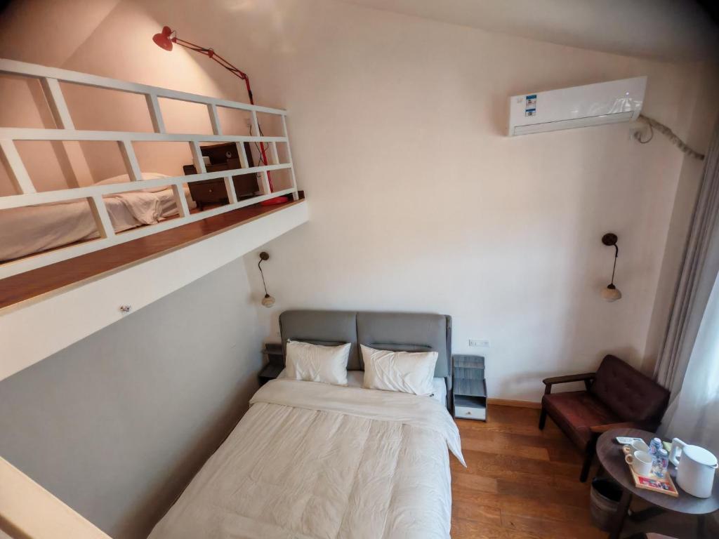Voodi või voodid majutusasutuse Guilin Camphor Country House -Free pick up service toas