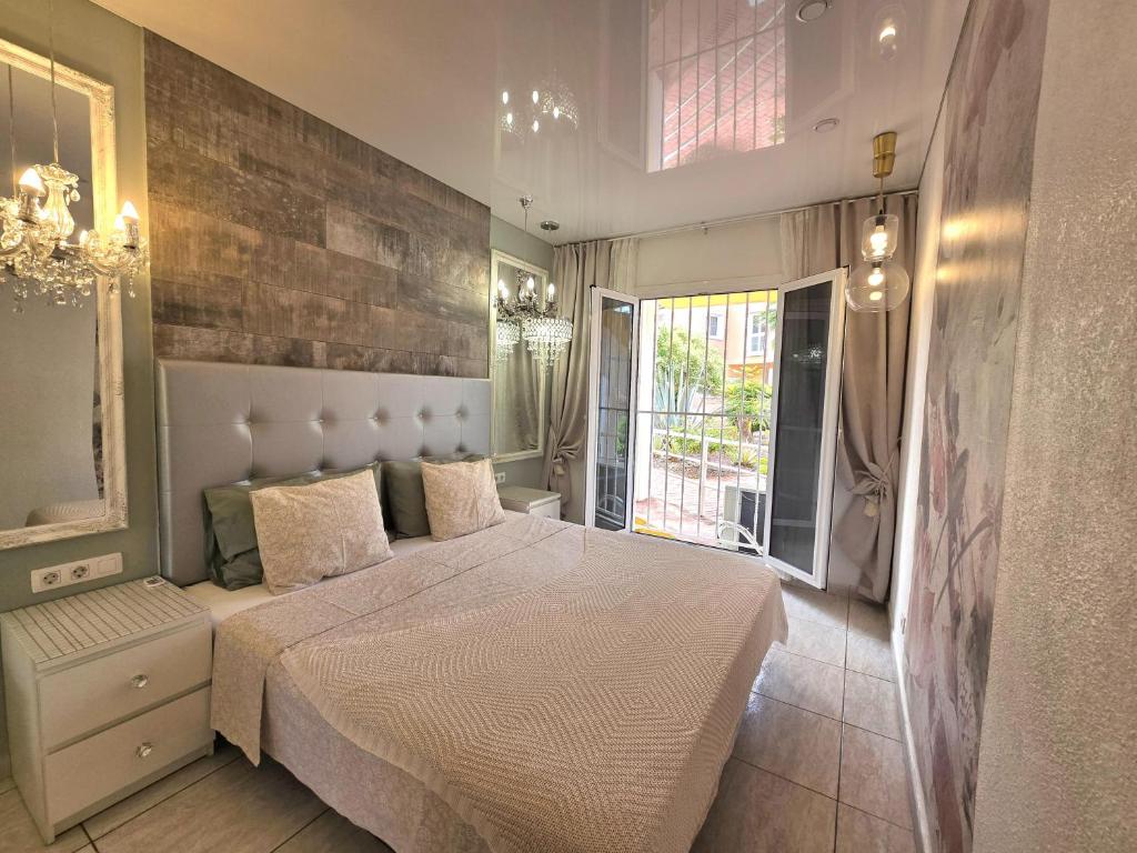 Posteľ alebo postele v izbe v ubytovaní Apartment Orlando Sea